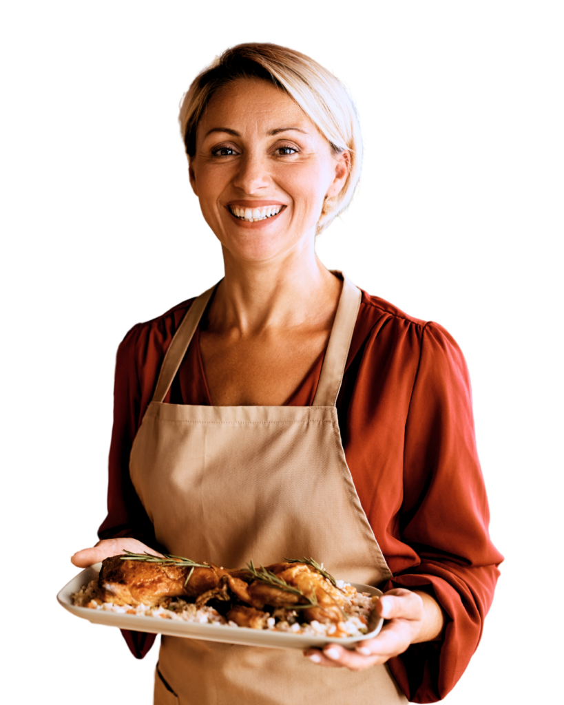 Lady in apron holding a a plate of food